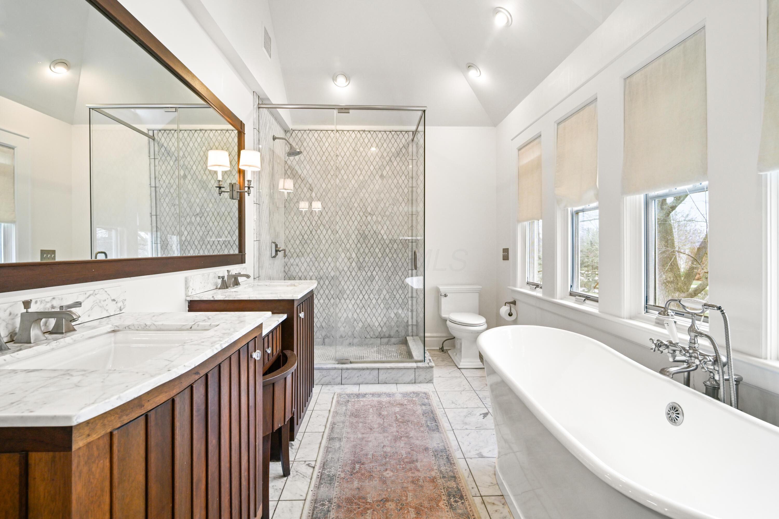 1960 Chelsea Road Columbus, OH 43212 - Photo 25 of 60 Large primary bathroom with double vanity, heated floors, soaking tub and separate shower.