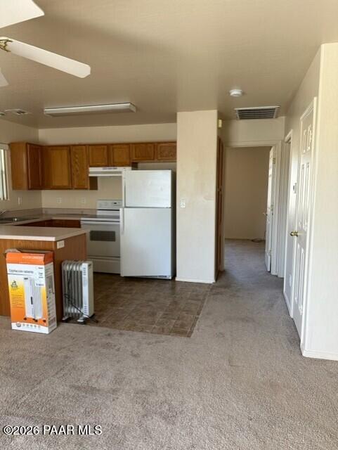 4757 North Robert Road, Unit A Prescott Valley, AZ 86314 - Photo 2 of 5 a view of a kitchen with refrigerator and microwave
