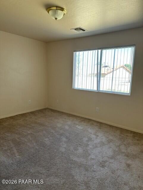 4757 North Robert Road, Unit A Prescott Valley, AZ 86314 - Photo 3 of 5 an empty room with a window