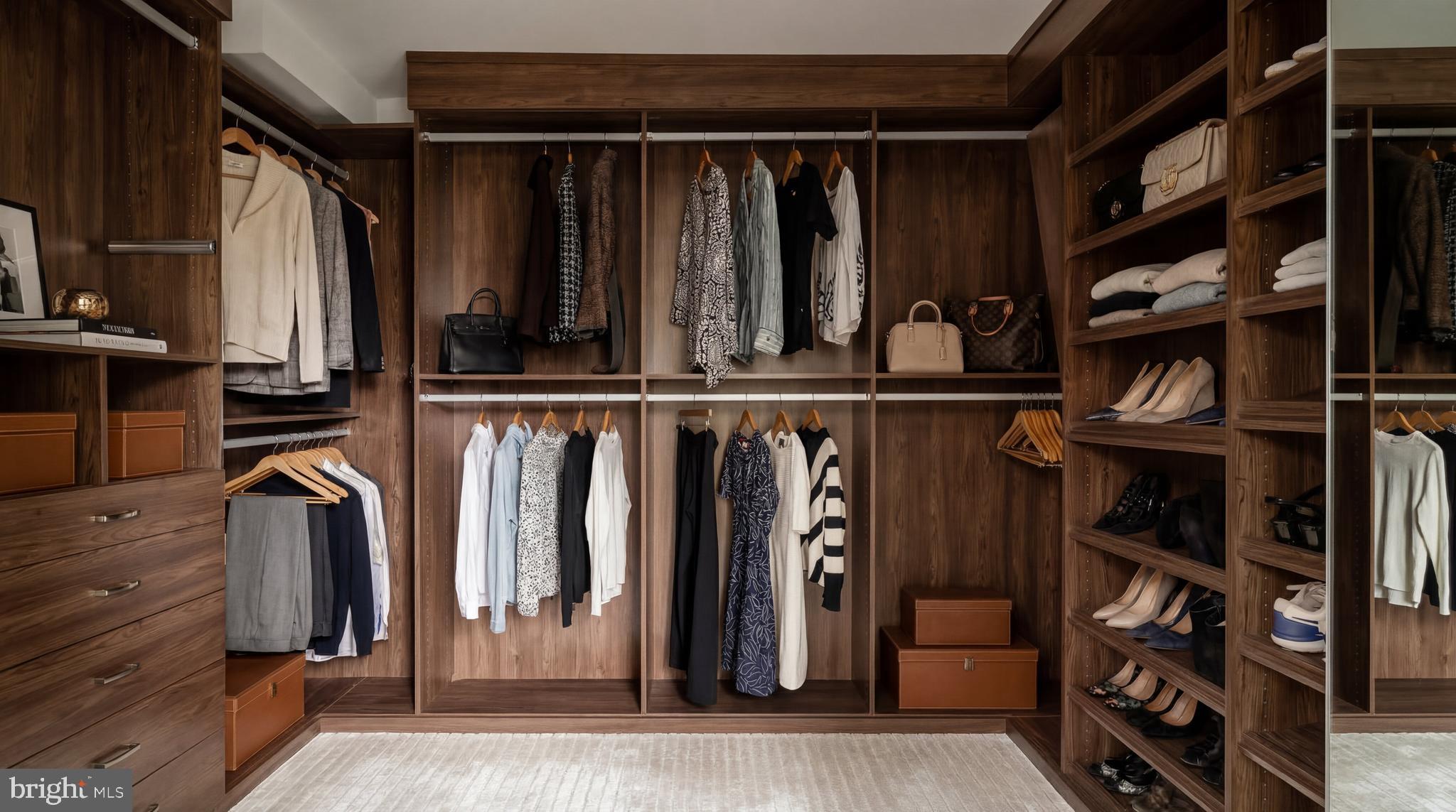 3117 O Street Northwest Washington, DC 20007 - Photo 29 of 50 a view of walk in closet with clothes and shoes