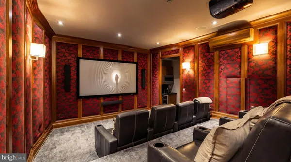 a living room with furniture a fireplace and a large window