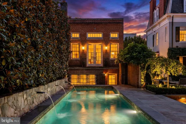 a view of a swimming pool and an outdoor space