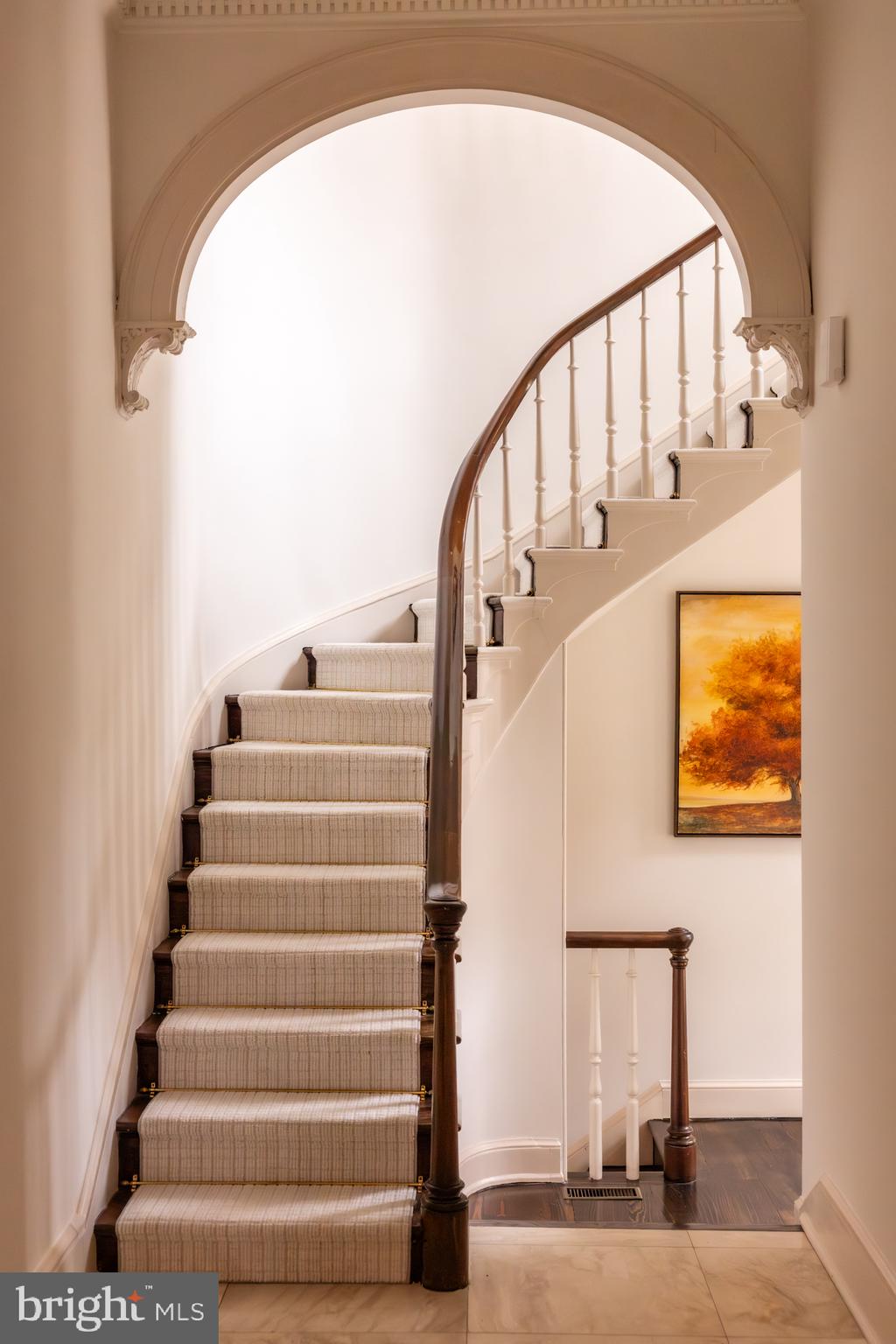 3117 O Street Northwest Washington, DC 20007 - Photo 7 of 50 a view of staircase with white walls and a window
