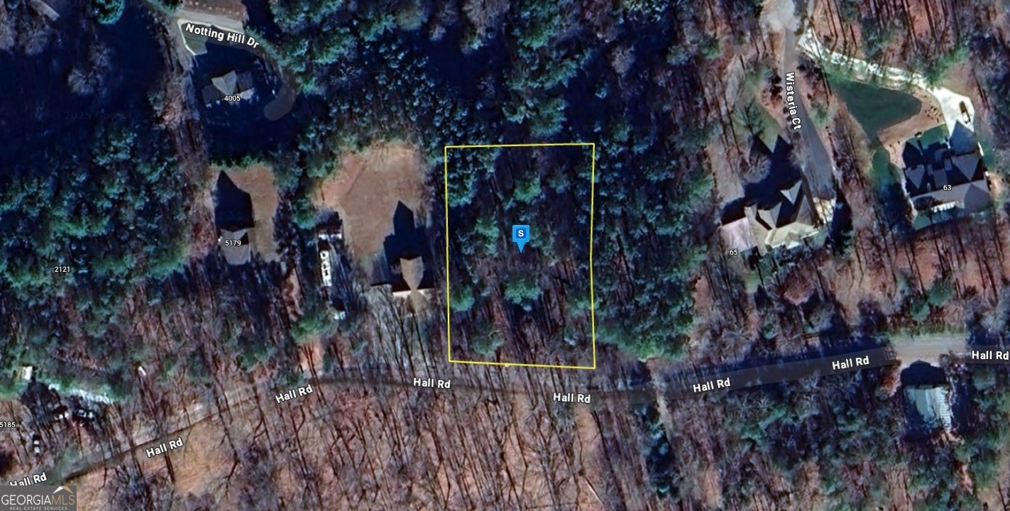 a view of a house with a tree