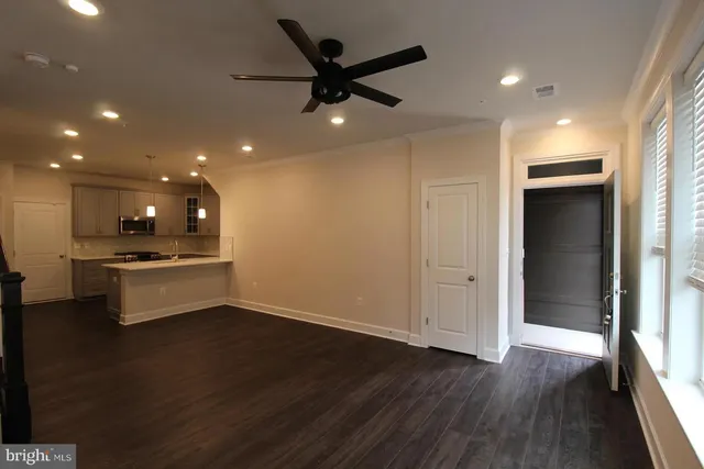 a view of kitchen with wooden floor and window