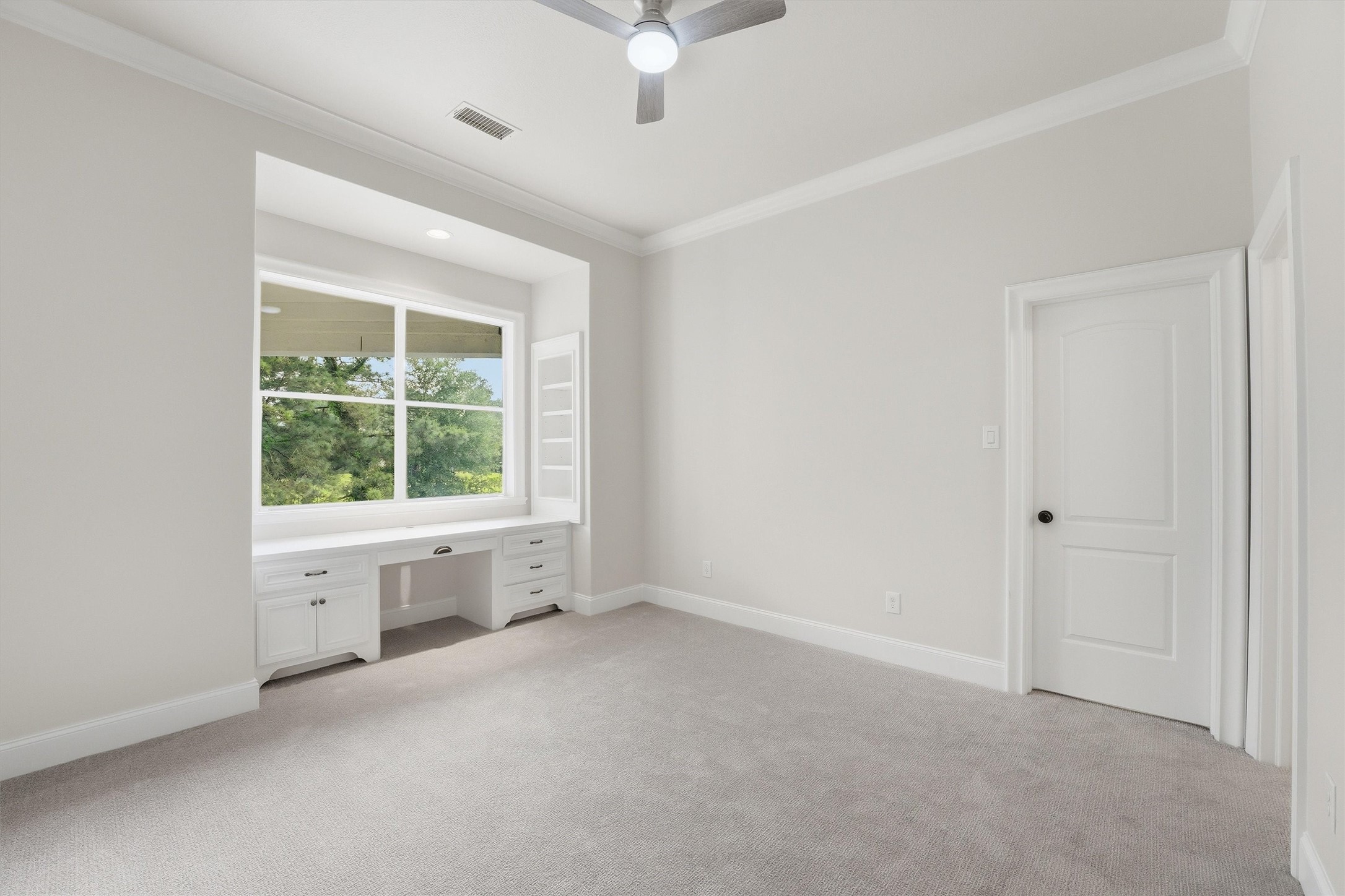 70 Quail Rock Place The Woodlands, TX 77381 - Photo 30 of 46 a view of an empty room with a window