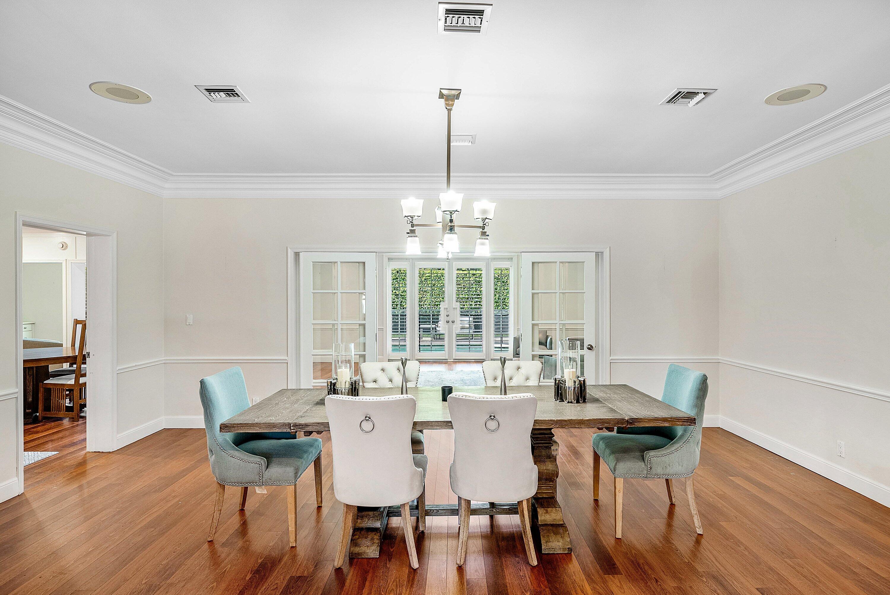 2121 Areca Palm Road Boca Raton, FL 33432 - Photo 11 of 54 a view of a dining room with furniture window and wooden floor