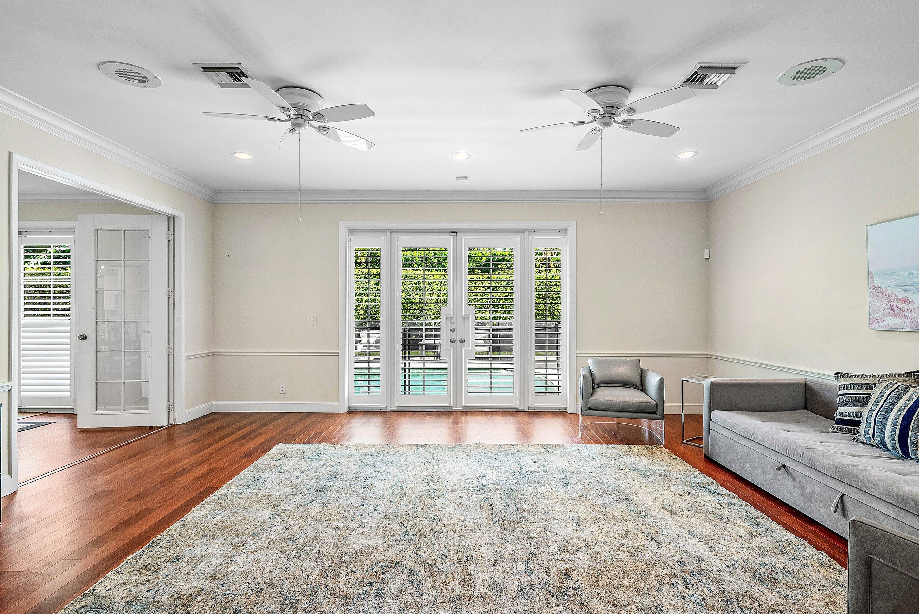 2121 Areca Palm Road Boca Raton, FL 33432 - Photo 14 of 54 a living room with furniture and a large window