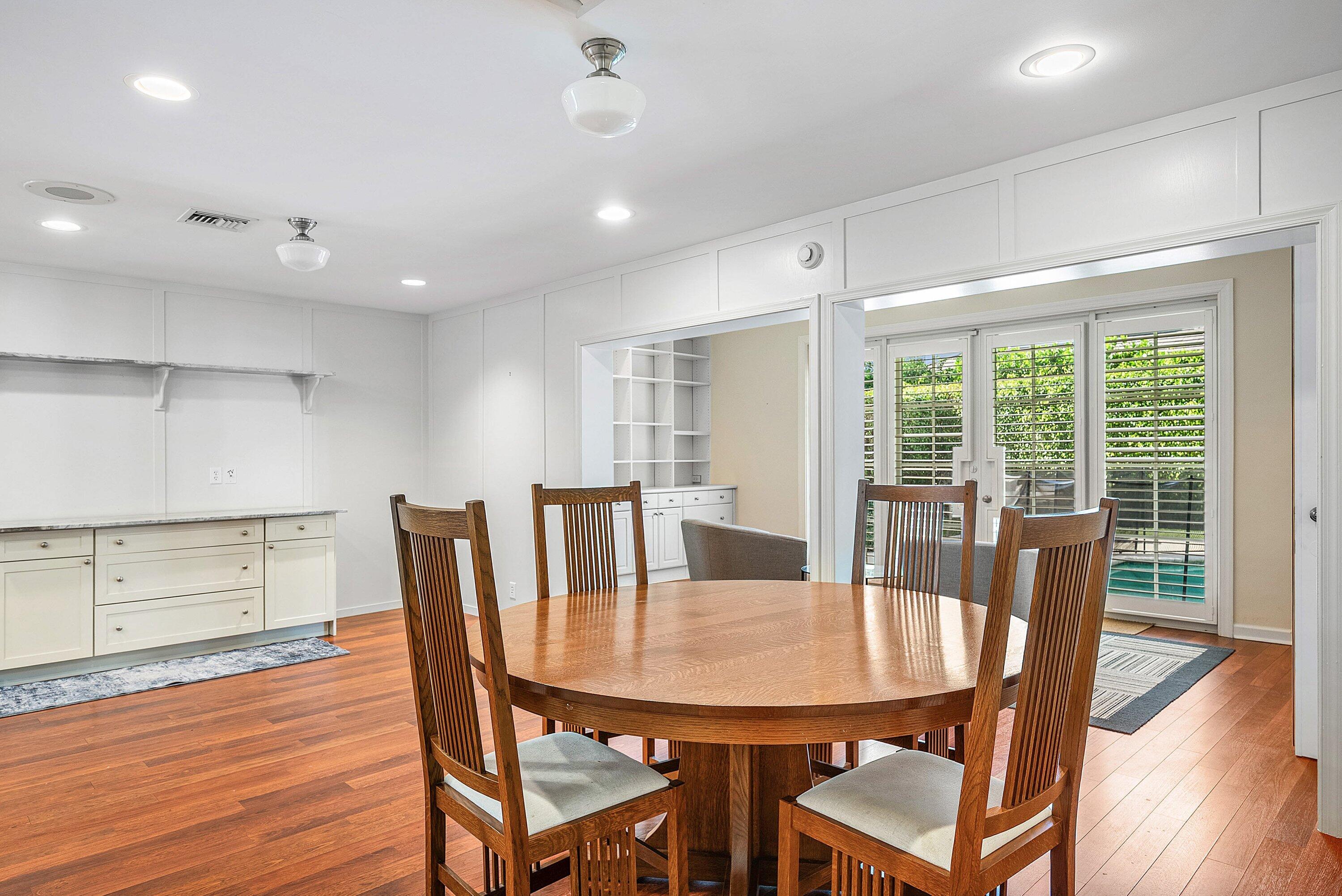 2121 Areca Palm Road Boca Raton, FL 33432 - Photo 19 of 54 a view of a dining room with furniture window and wooden floor