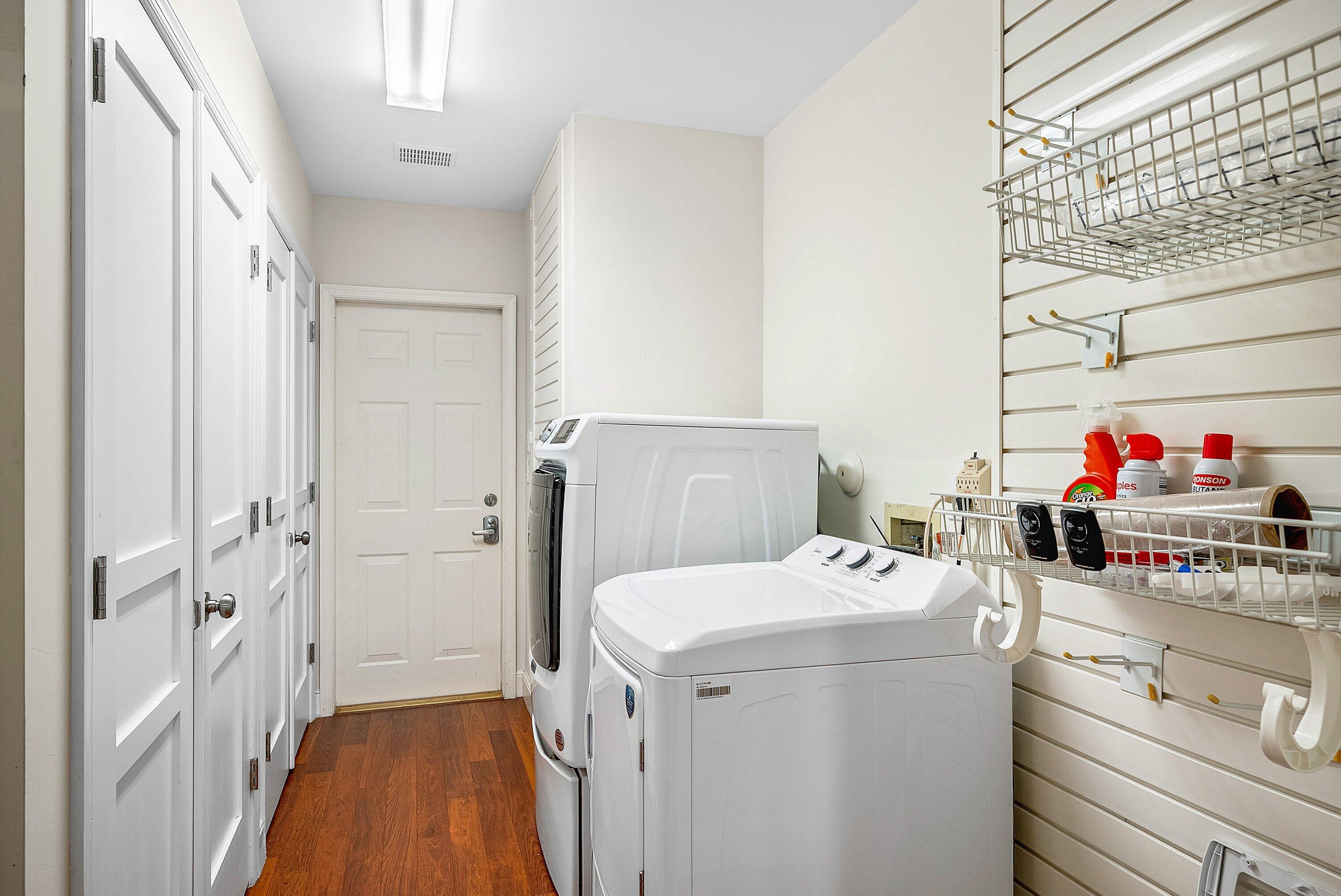 2121 Areca Palm Road Boca Raton, FL 33432 - Photo 20 of 54 a utility room with dryer and washer