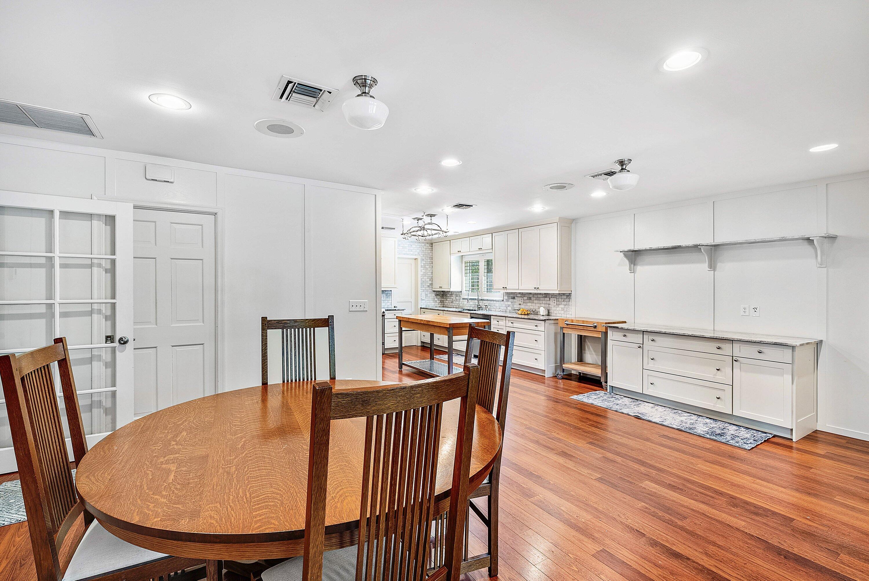 2121 Areca Palm Road Boca Raton, FL 33432 - Photo 26 of 54 a view of a dining room with furniture and wooden floor