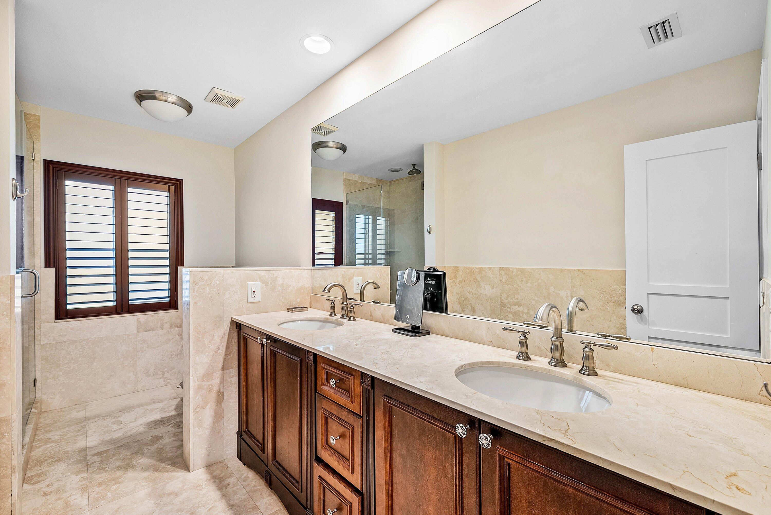 2121 Areca Palm Road Boca Raton, FL 33432 - Photo 29 of 54 a bathroom with a sink double vanity and a mirror