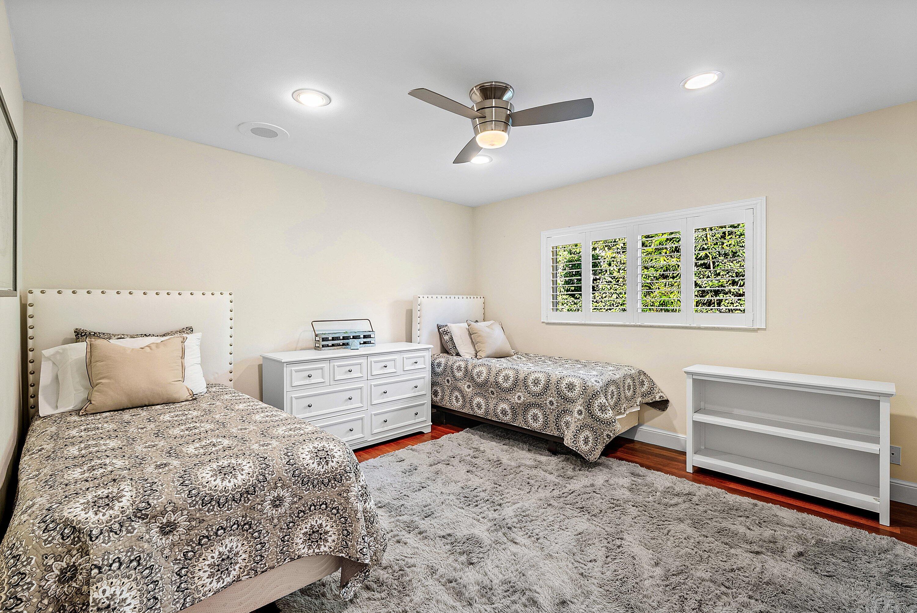 2121 Areca Palm Road Boca Raton, FL 33432 - Photo 31 of 54 a bedroom with a large bed and a window