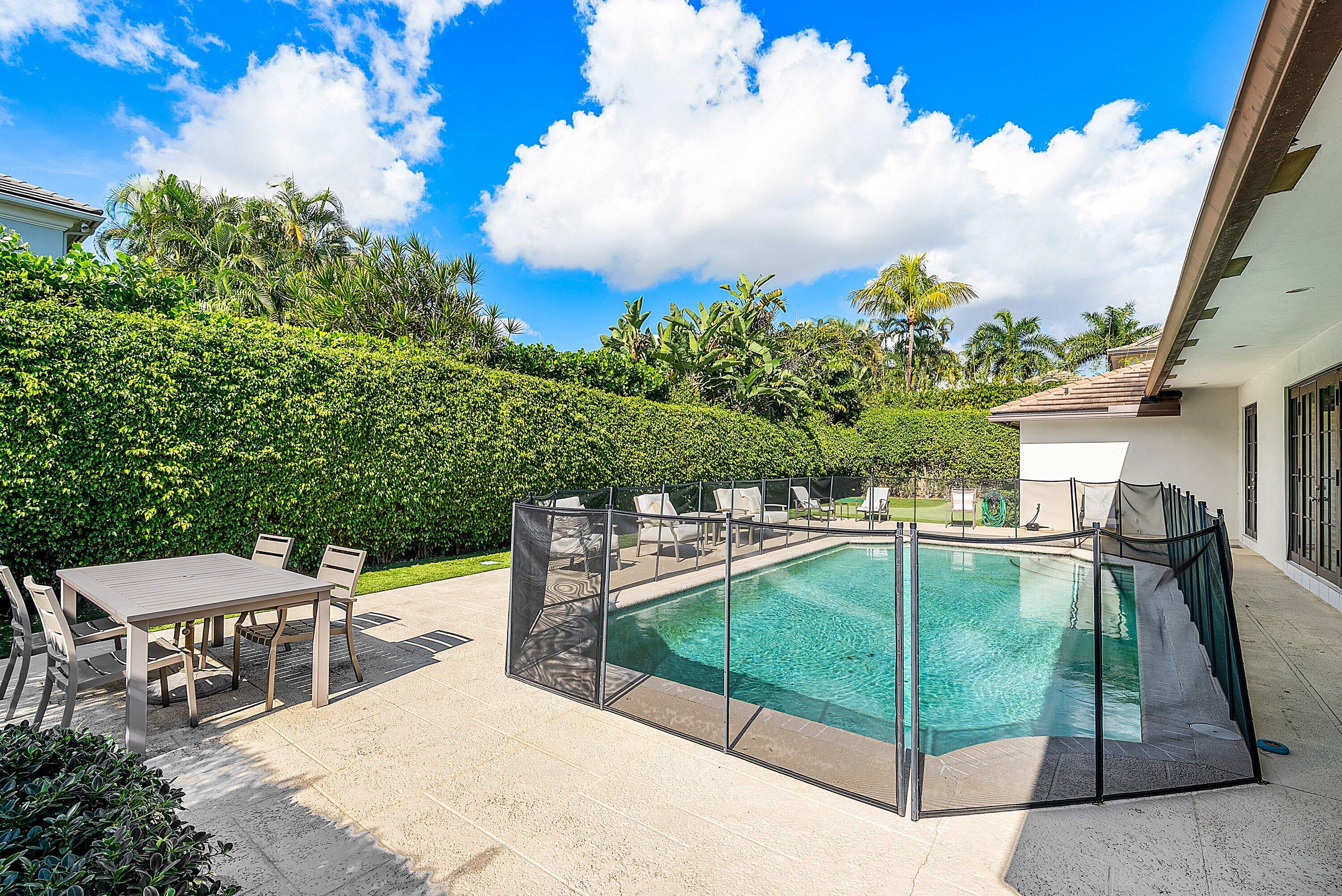 2121 Areca Palm Road Boca Raton, FL 33432 - Photo 42 of 54 a view of a patio with swimming pool