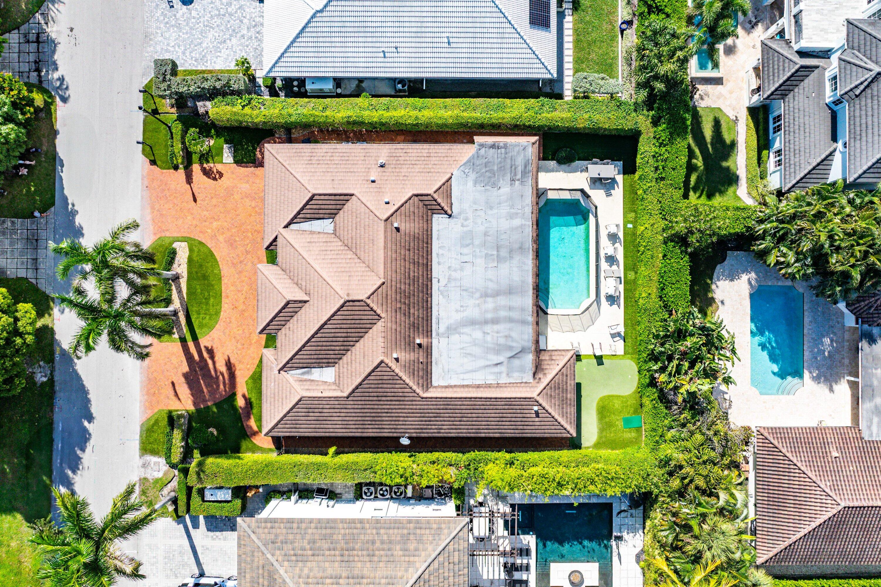 2121 Areca Palm Road Boca Raton, FL 33432 - Photo 45 of 54 an aerial view of a house with yard and outdoor seating