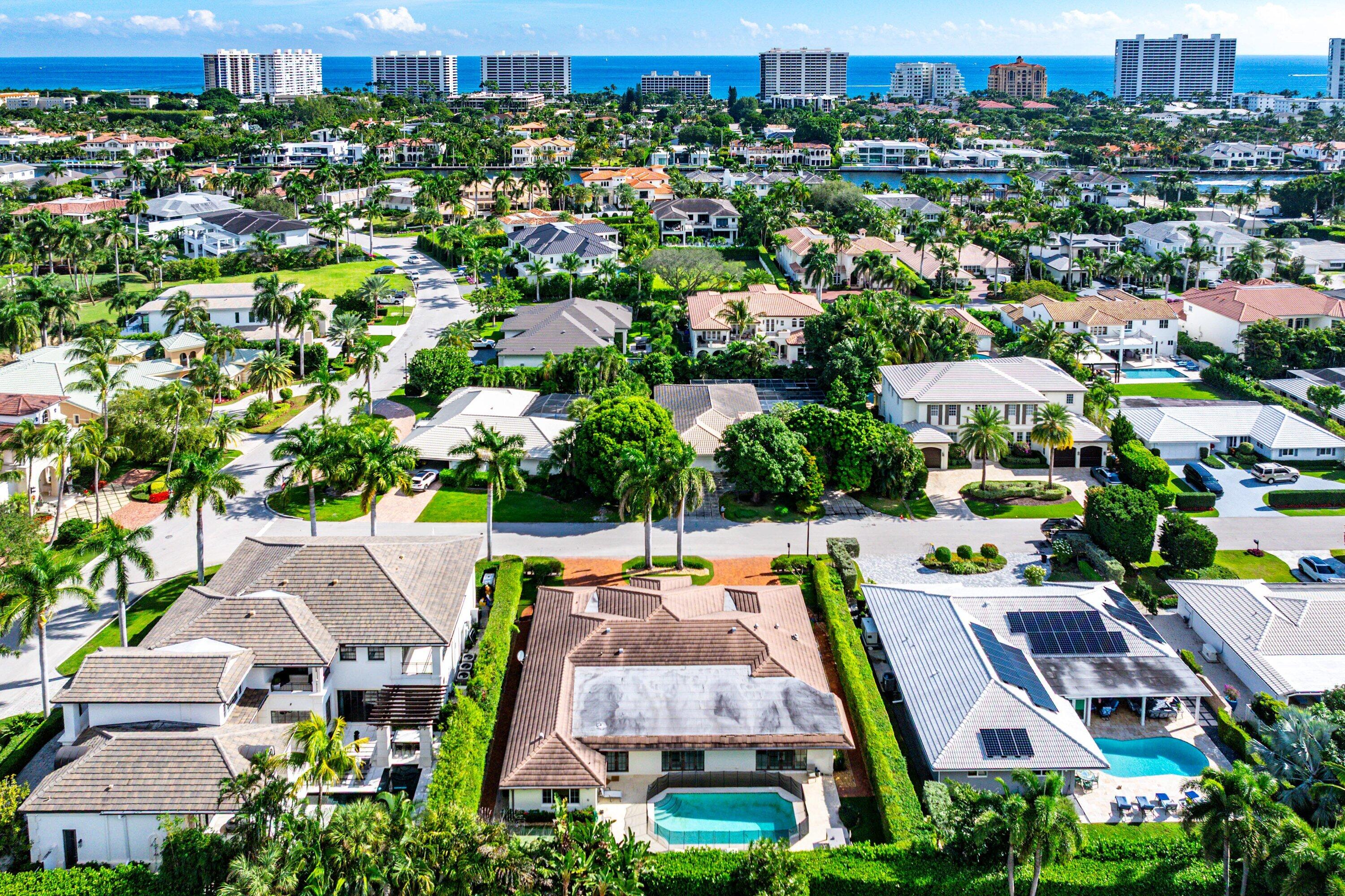 2121 Areca Palm Road Boca Raton, FL 33432 - Photo 54 of 54 an aerial view of multiple houses with yard