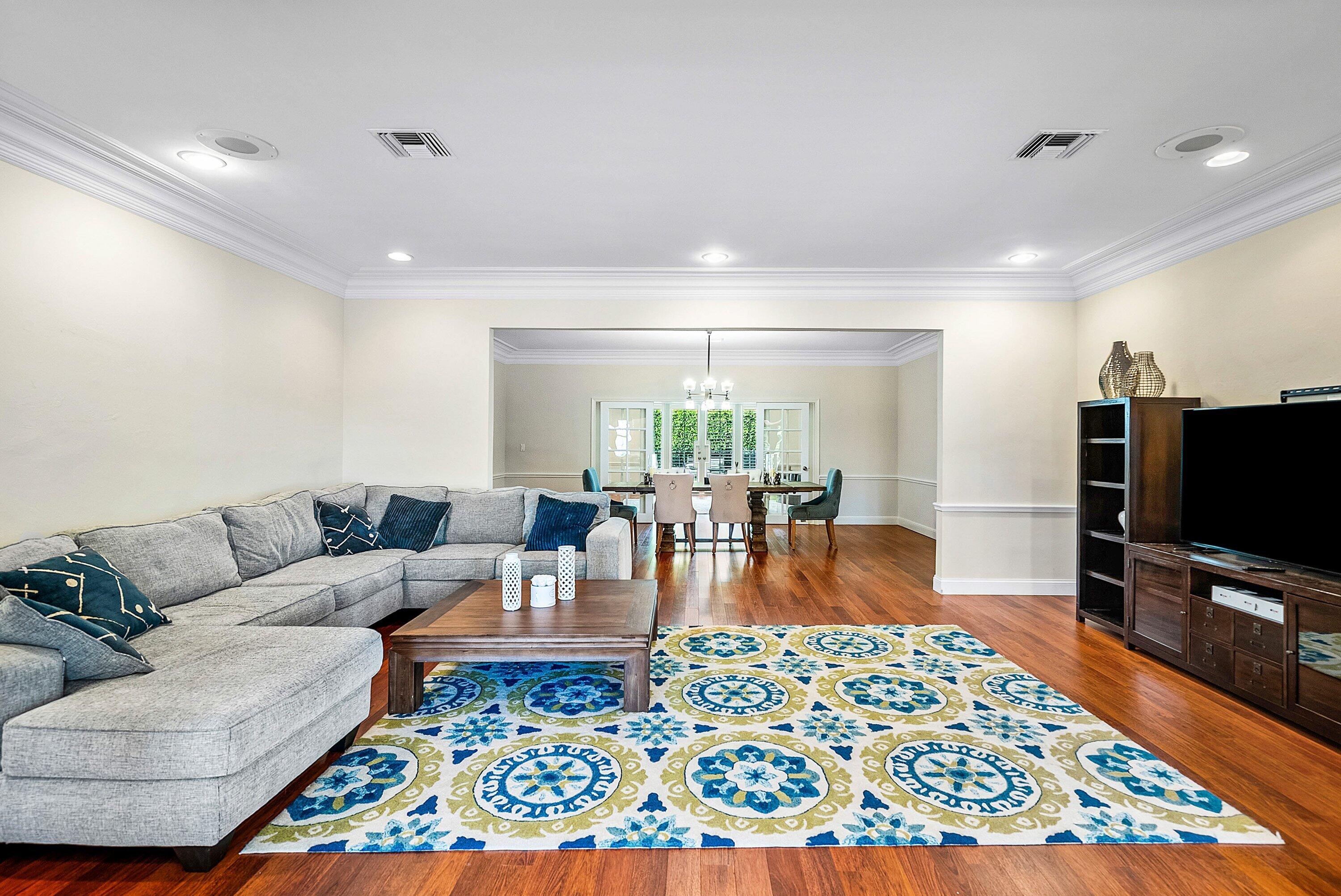 2121 Areca Palm Road Boca Raton, FL 33432 - Photo 8 of 54 a living room with furniture and a flat screen tv