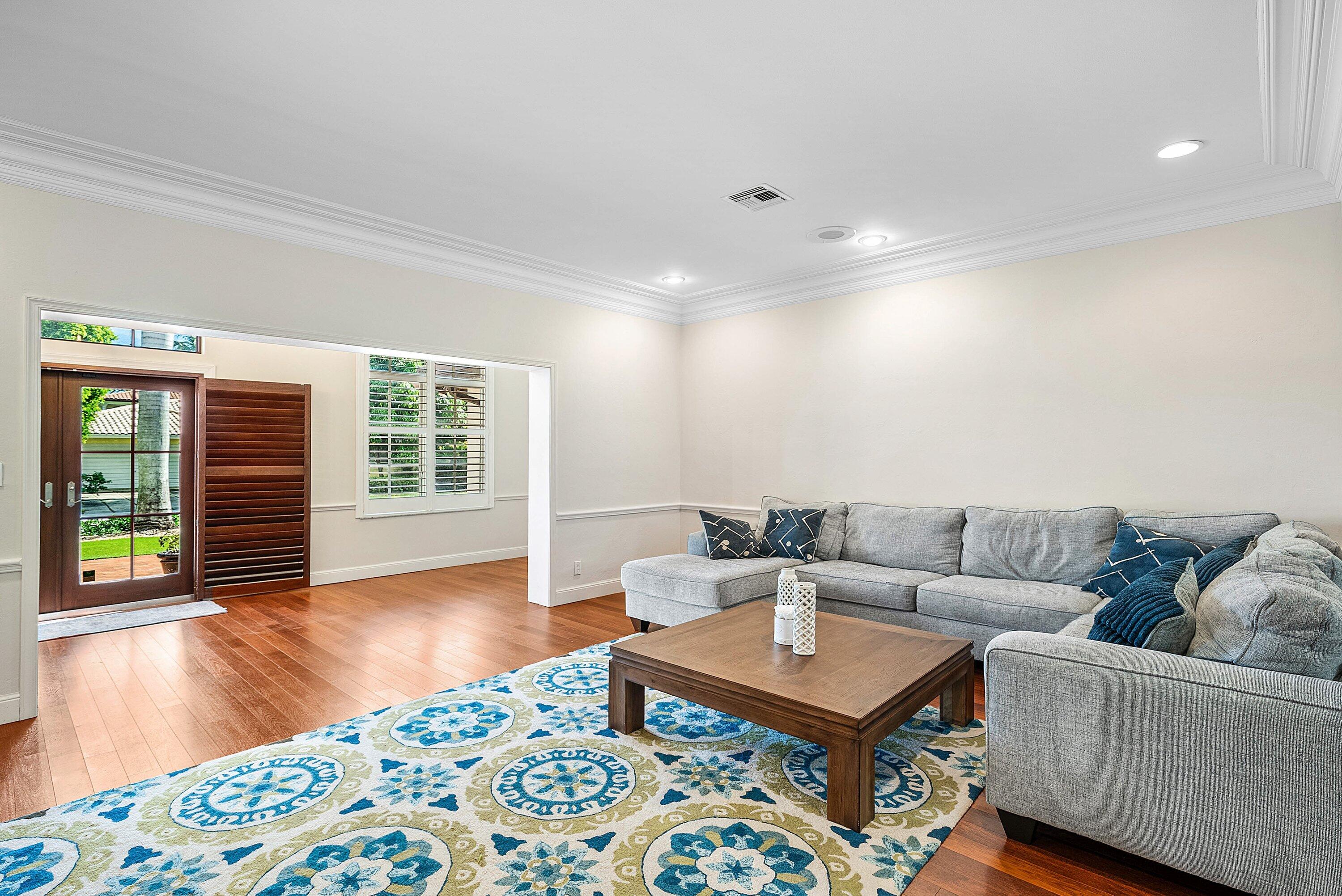 2121 Areca Palm Road Boca Raton, FL 33432 - Photo 9 of 54 a living room with furniture and a wooden floor