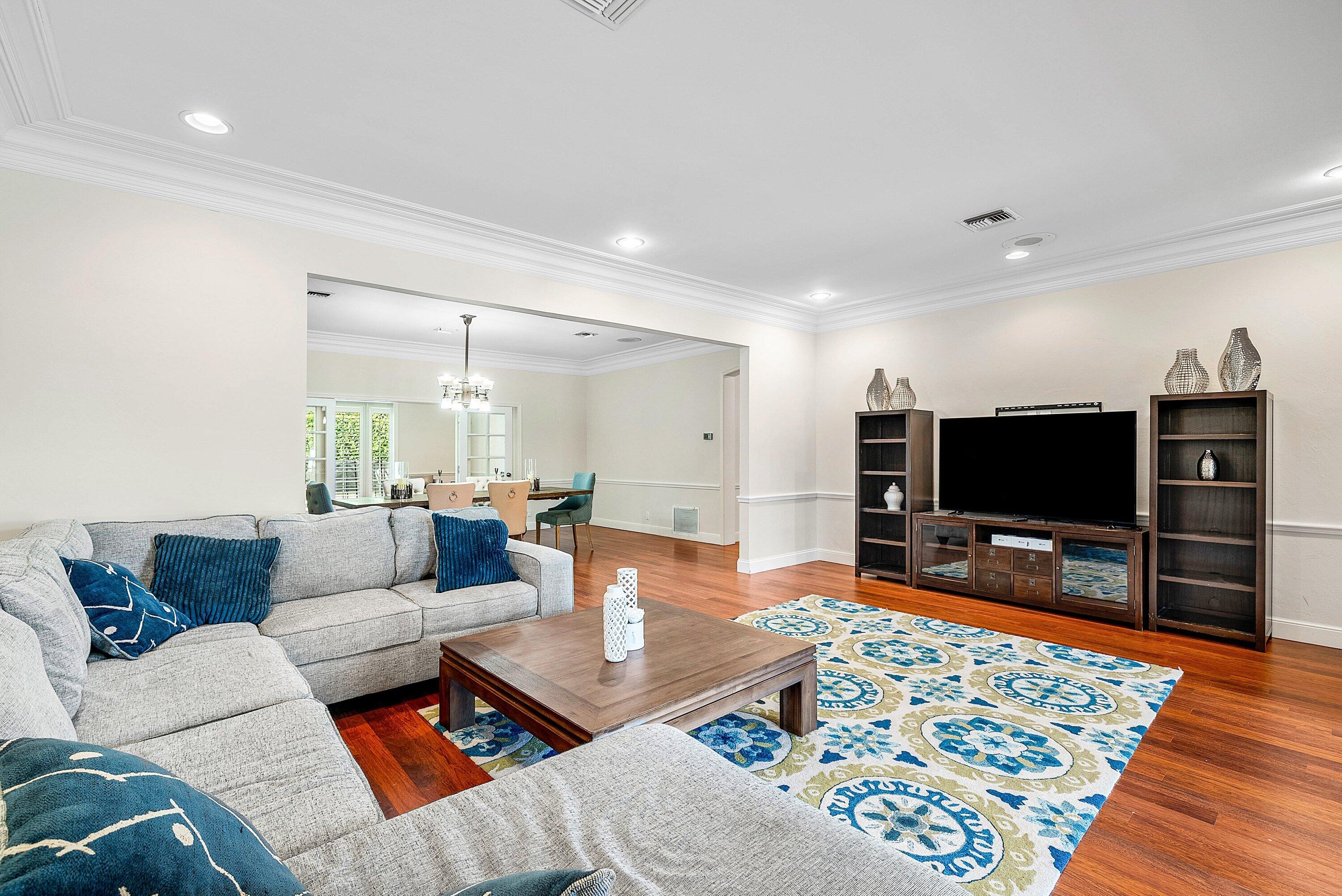 2121 Areca Palm Road Boca Raton, FL 33432 - Photo 10 of 54 a living room with furniture and a flat screen tv