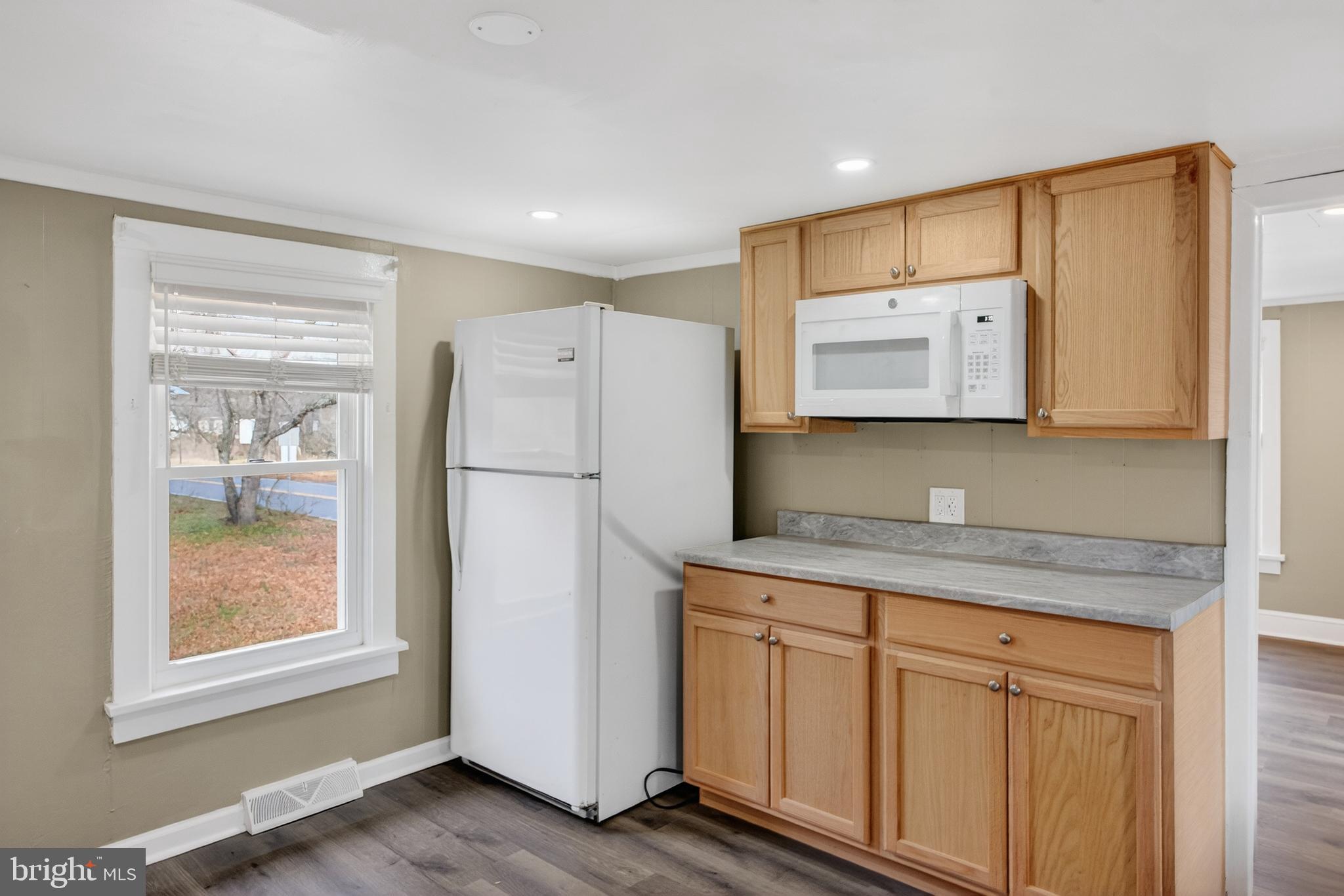171 Skeet Road Medford, NJ 08055 - Photo 9 of 17 a kitchen with a refrigerator sink and cabinets