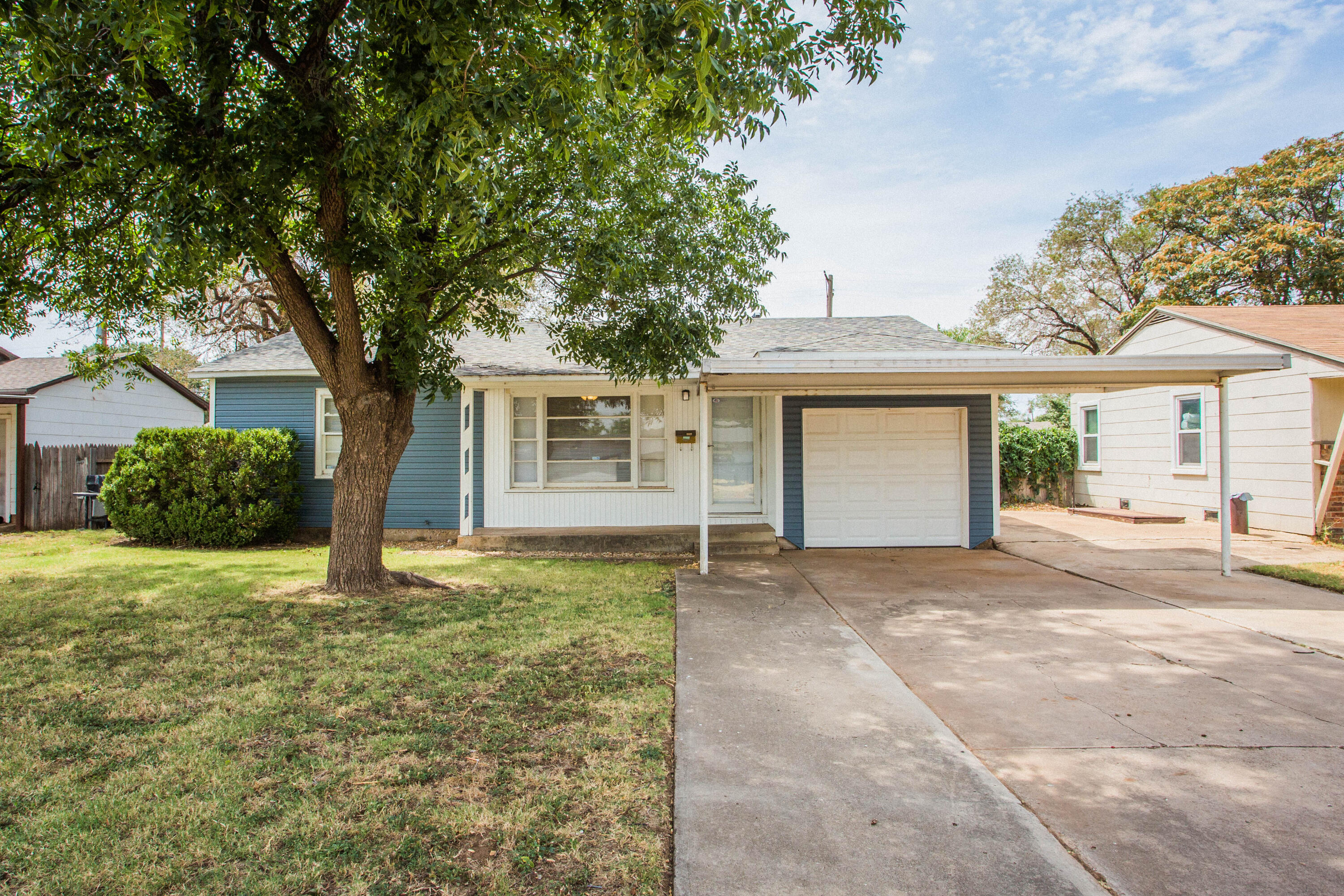front view of a house with a yard