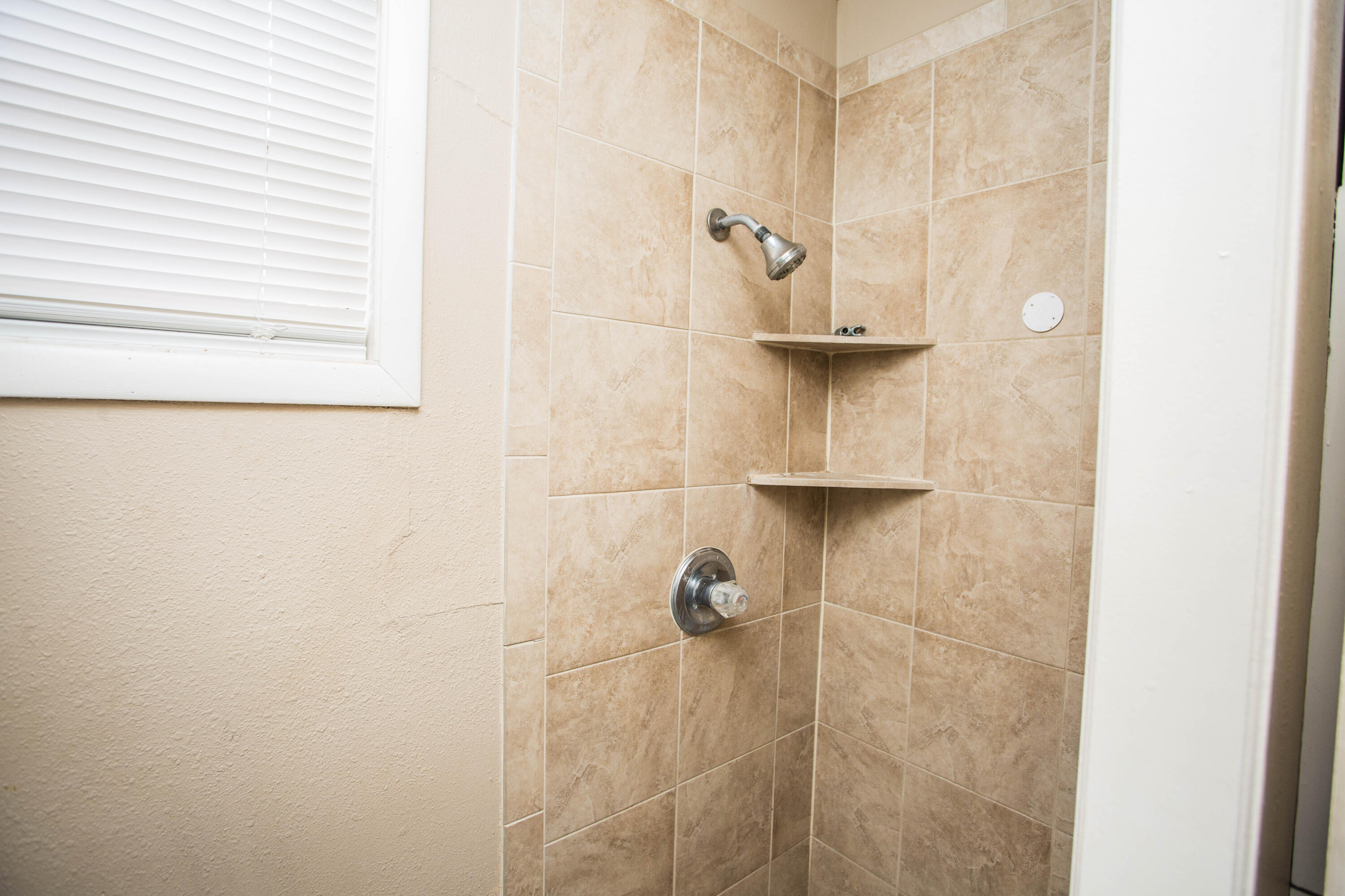 4309 42nd Street Lubbock, TX 79413 - Photo 13 of 25 a bathroom with a shower