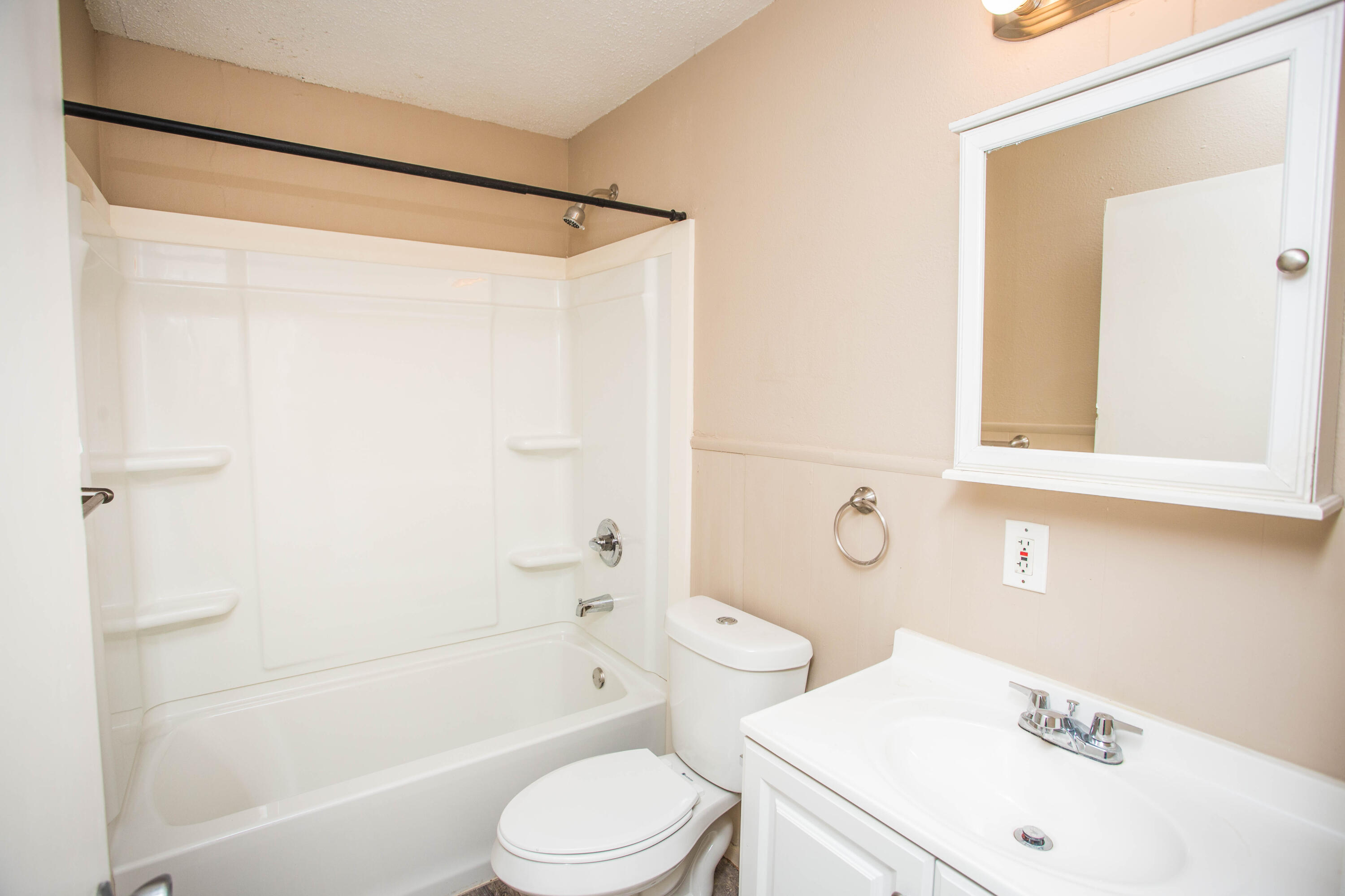 4309 42nd Street Lubbock, TX 79413 - Photo 20 of 25 a bathroom with a sink toilet and shower