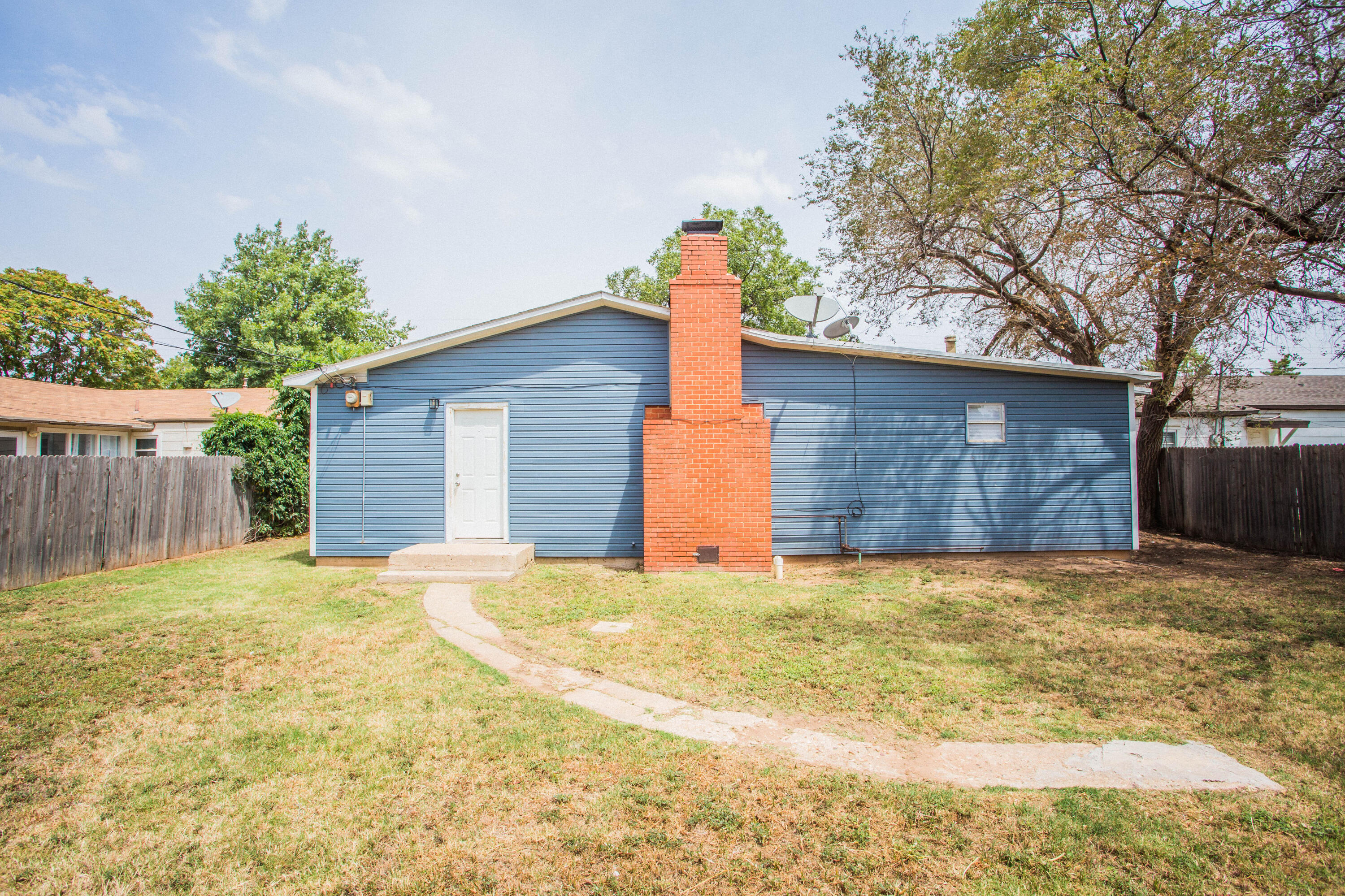 4309 42nd Street Lubbock, TX 79413 - Photo 23 of 25 a house with yard in front of it