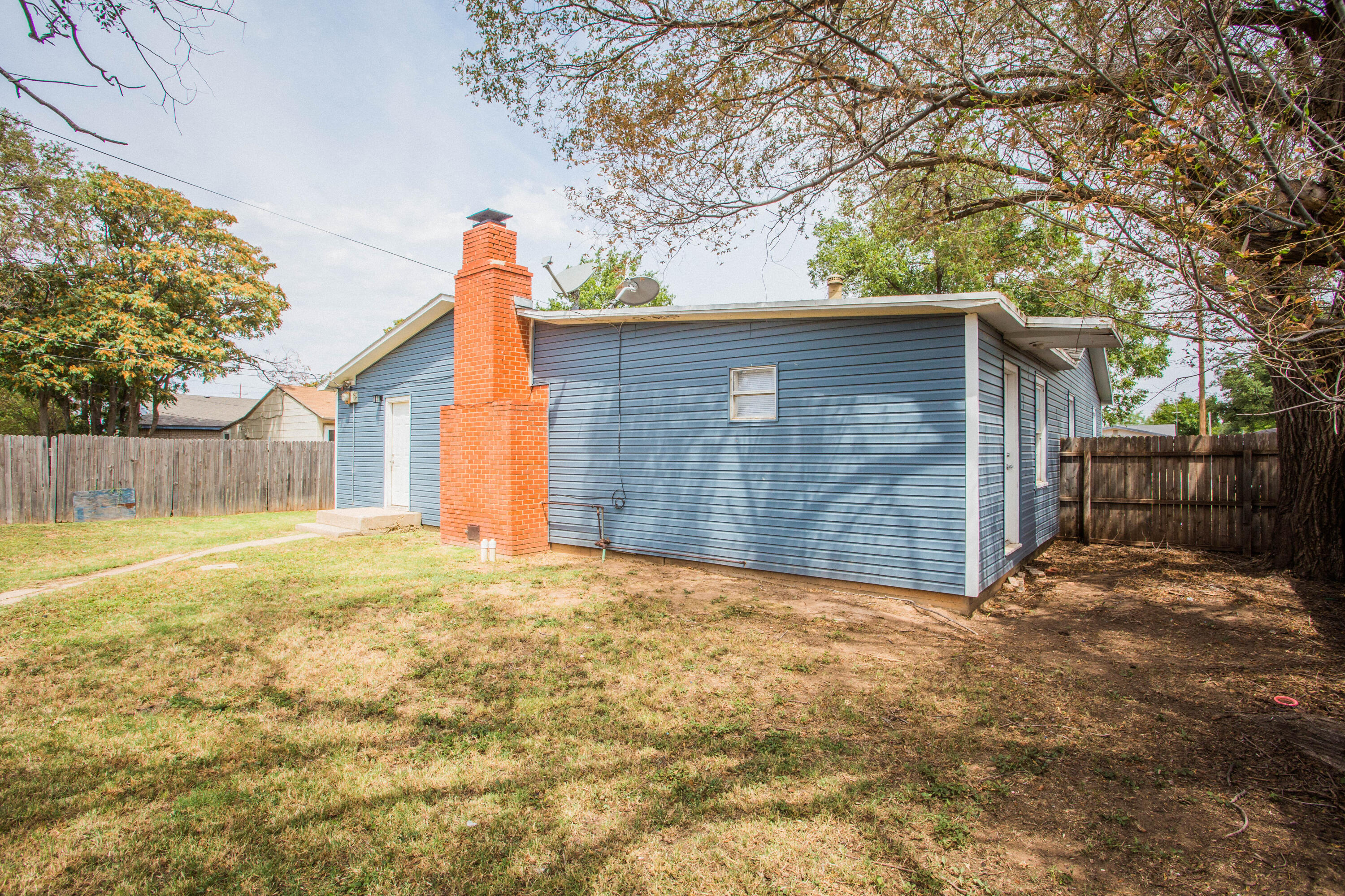 4309 42nd Street Lubbock, TX 79413 - Photo 24 of 25 a view of a house with a yard and garage