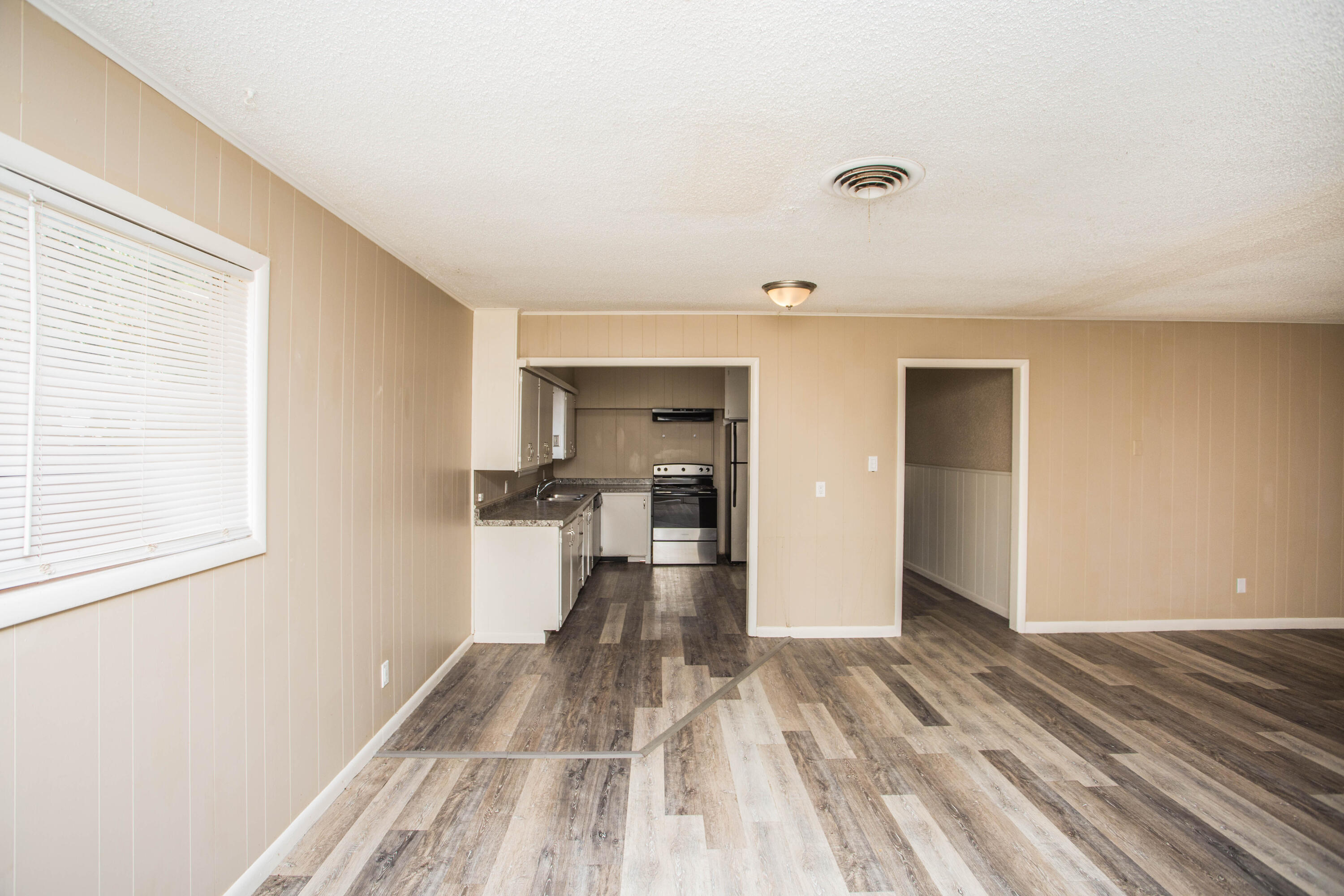 4309 42nd Street Lubbock, TX 79413 - Photo 6 of 25 a view of a living room hardwood floor and a window