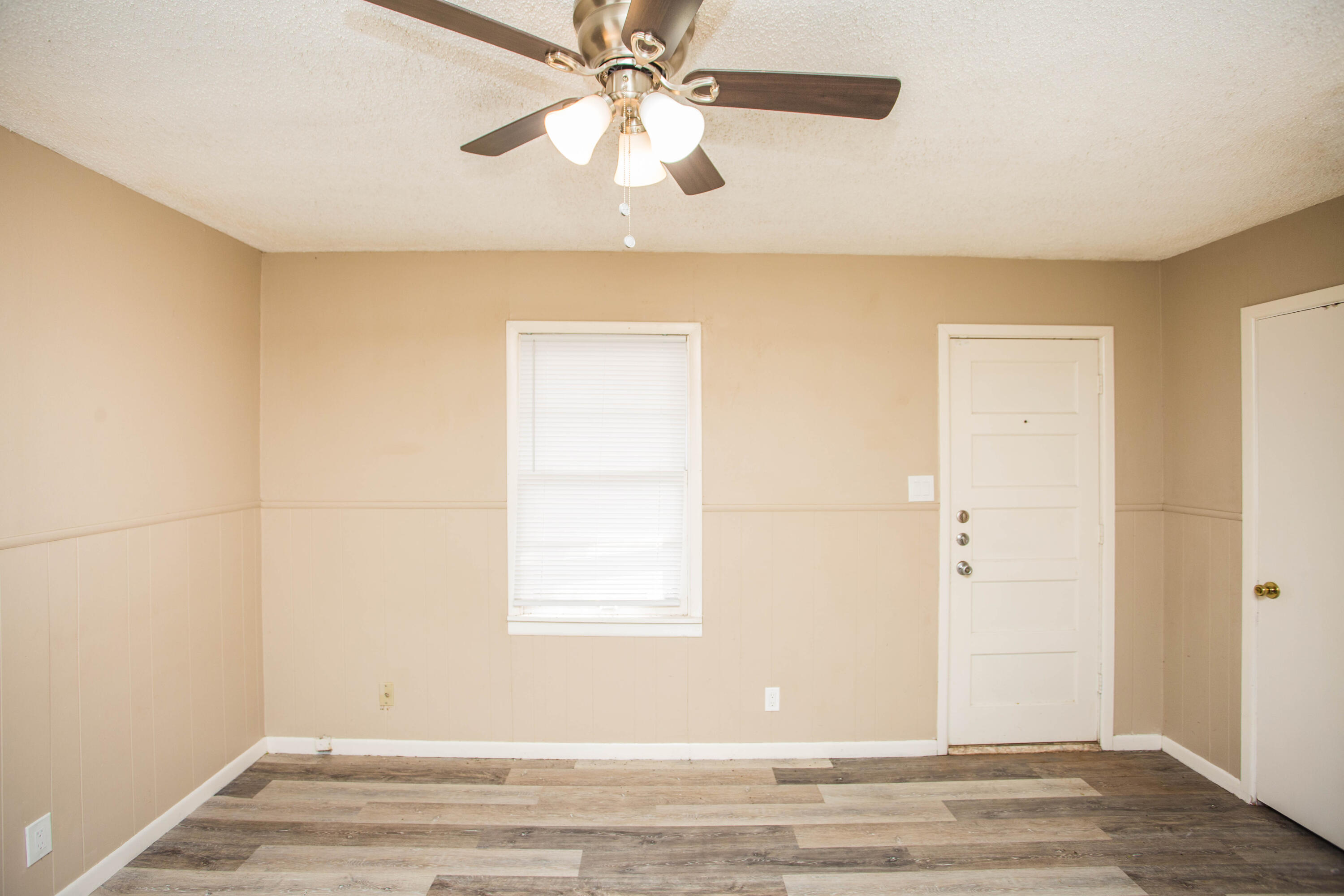 4309 42nd Street Lubbock, TX 79413 - Photo 10 of 25 a view of an empty room with a window
