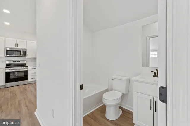 a bathroom with a toilet and a sink