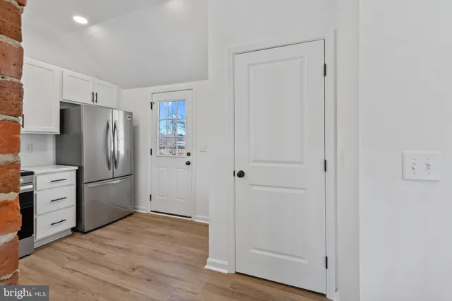 a kitchen with a refrigerator freezer and a dishwasher