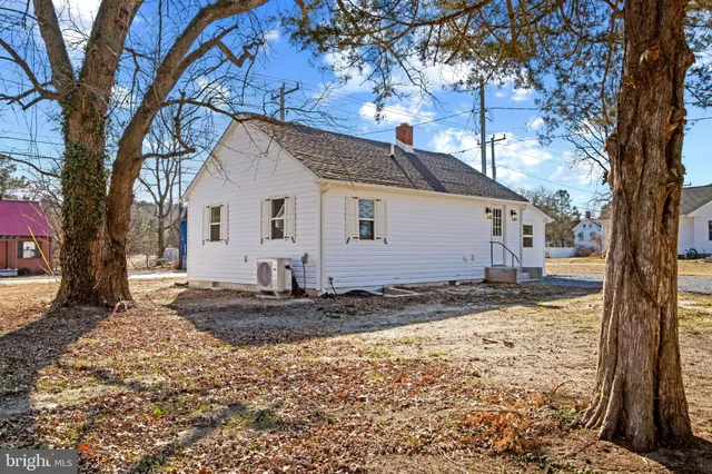a view of a house with a snow in the yard