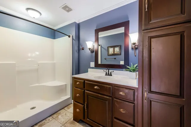 a bathroom with a bathtub and a shower