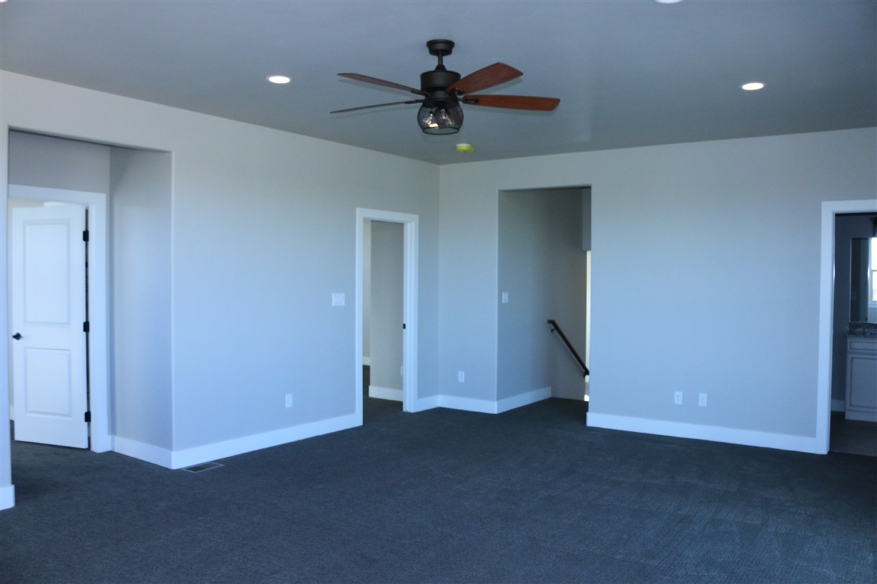 498 Tiara Rado Court Grand Junction, CO 81507 - Photo 11 of 20 a view of an empty room with a ceiling fan