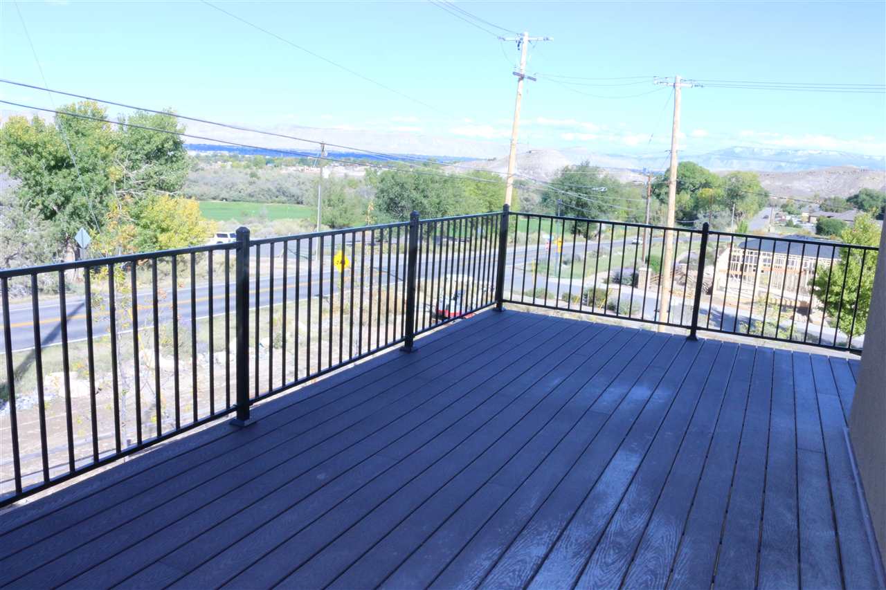 498 Tiara Rado Court Grand Junction, CO 81507 - Photo 14 of 20 a view of a balcony with wooden floor