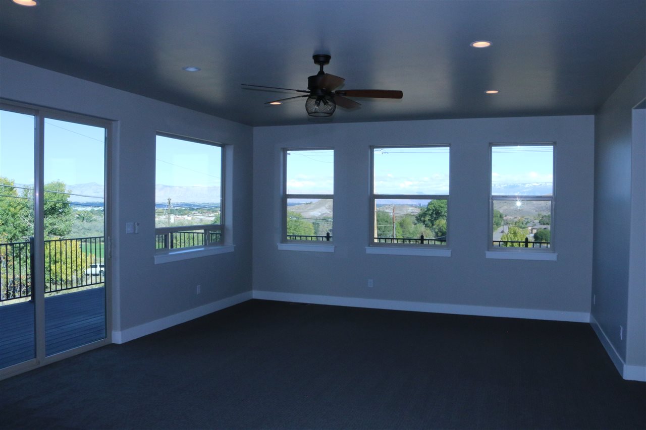498 Tiara Rado Court Grand Junction, CO 81507 - Photo 3 of 20 a view of an empty room with a window