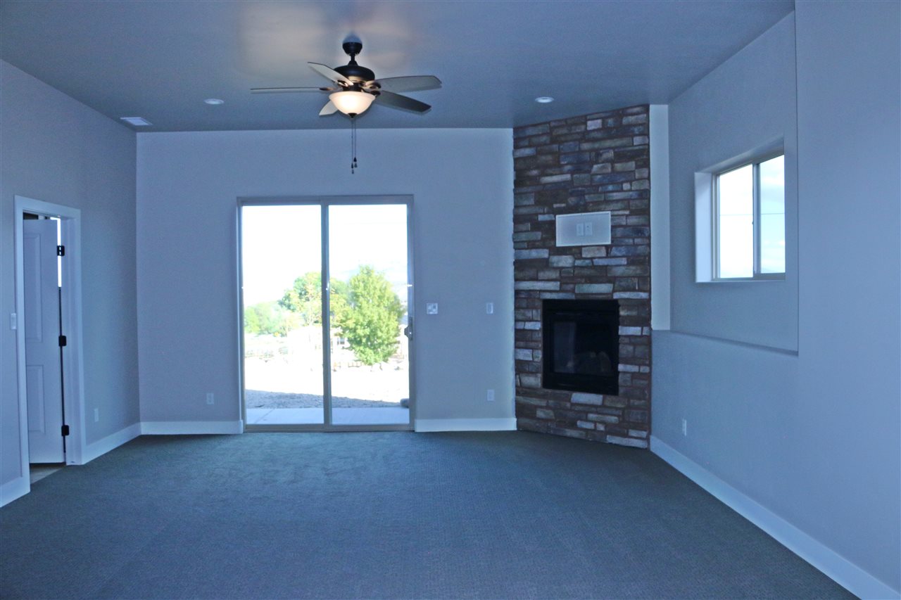 498 Tiara Rado Court Grand Junction, CO 81507 - Photo 4 of 20 a view of an empty room with a window