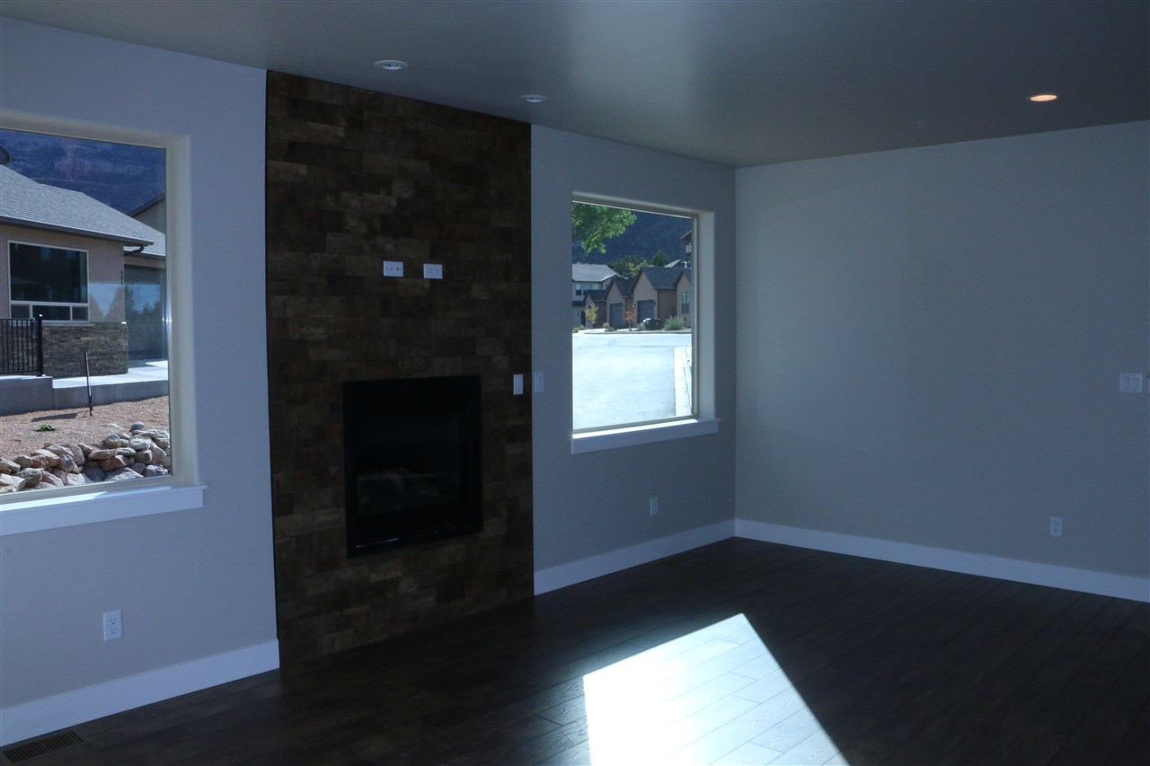 498 Tiara Rado Court Grand Junction, CO 81507 - Photo 8 of 20 wooden floor in an empty room