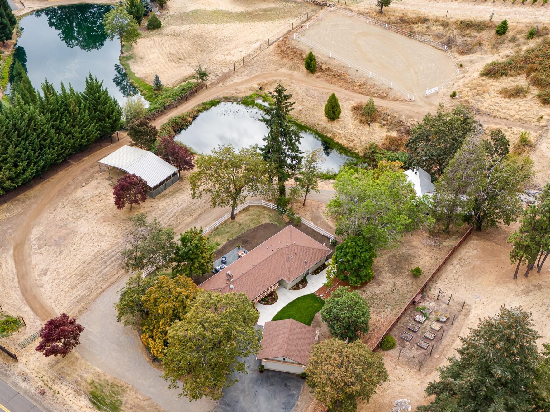 1865 Old Military Road Central Point, OR 97502 - Photo 4 of 77 Overhead view with pond and arena.