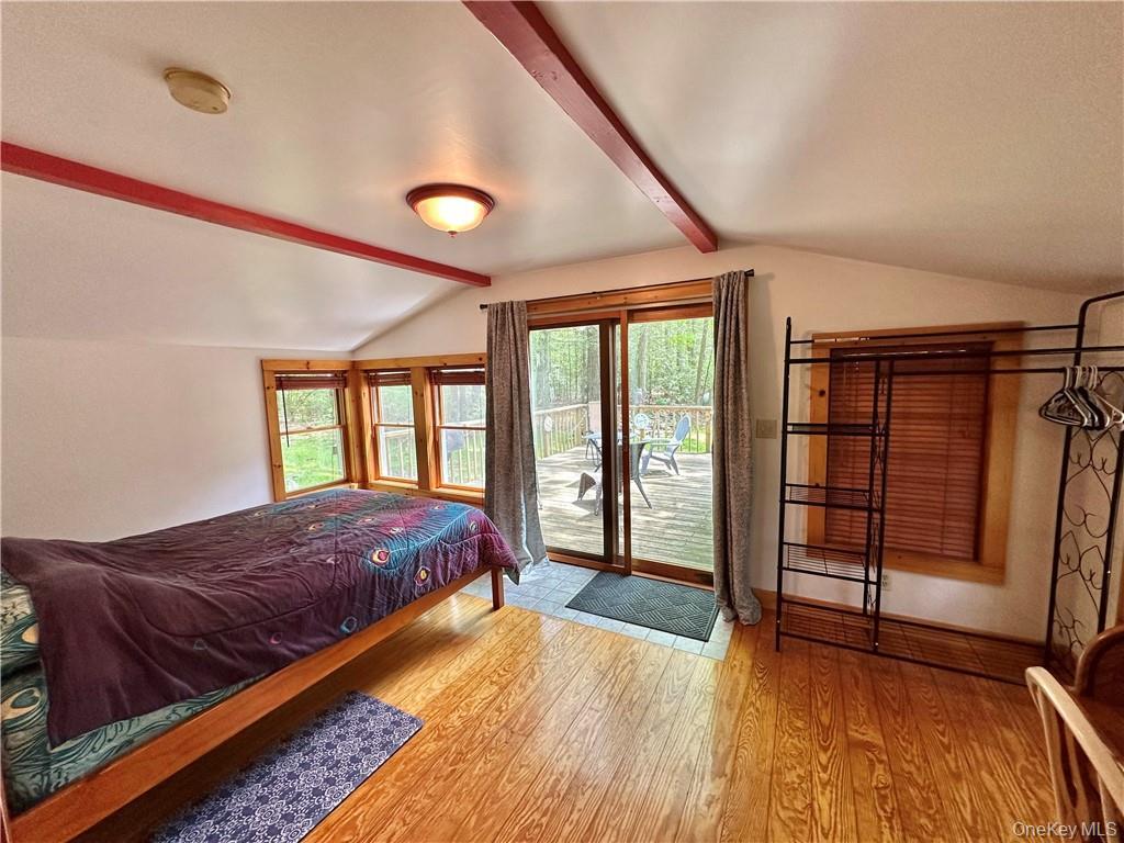 29 Dymond Road Kerhonkson, NY 12446 - Photo 13 of 18 a spacious bedroom with a bed and wooden floor