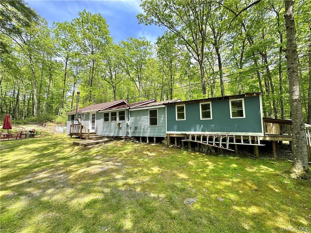 29 Dymond Road Kerhonkson, NY 12446 - Photo 3 of 18 a view of a house with pool and a yard
