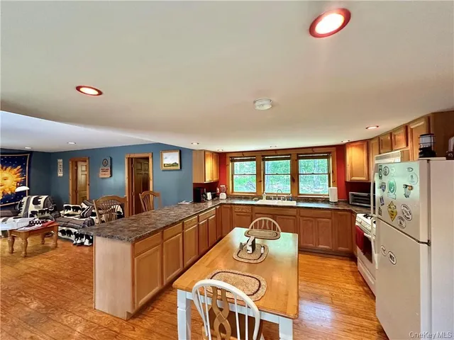 a very nice looking kitchen with granite countertop lots of counter top space