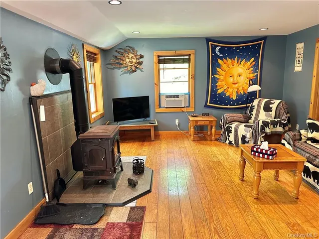 a room with furniture and a flat screen tv