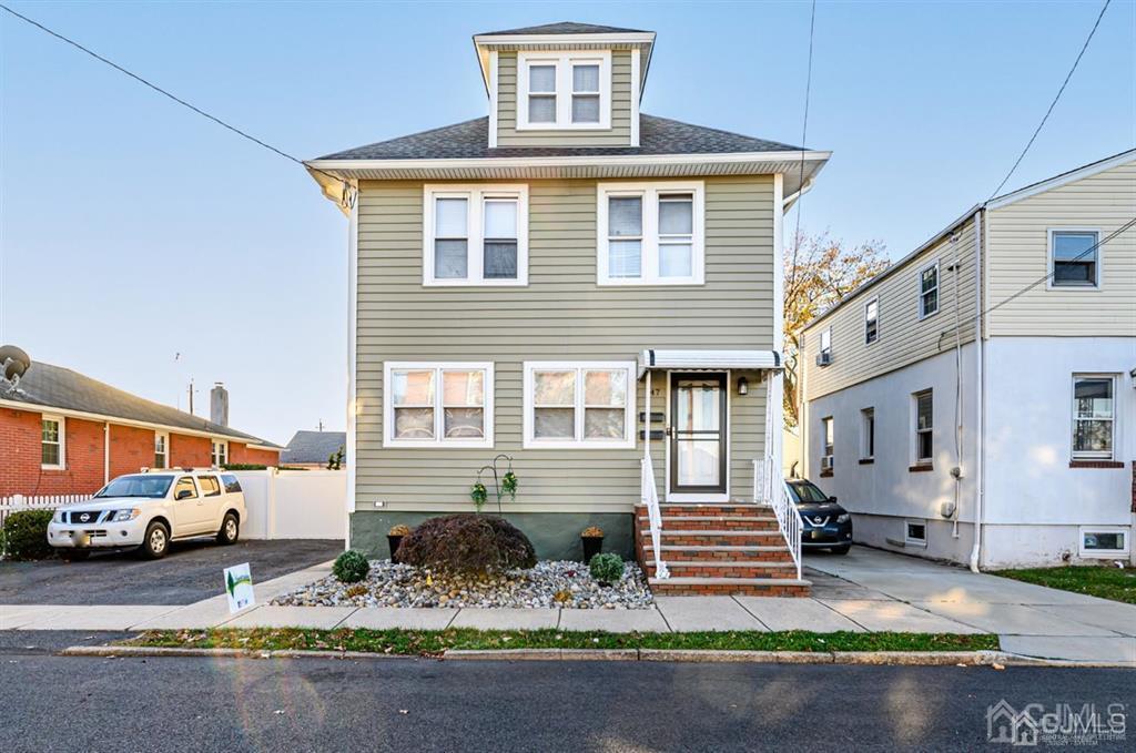 47 Marion Street Port Reading, NJ 07064 - Photo 1 of 57 a front view of a house with a yard