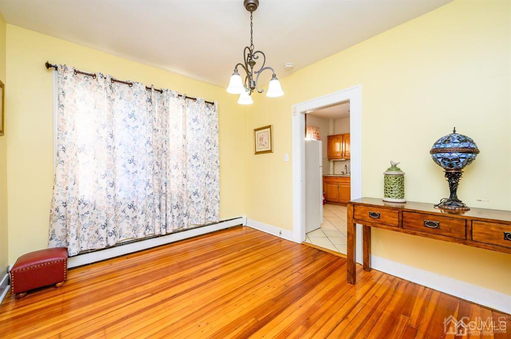 47 Marion Street Port Reading, NJ 07064 - Photo 11 of 57 a view of a room with wooden floor and staircase
