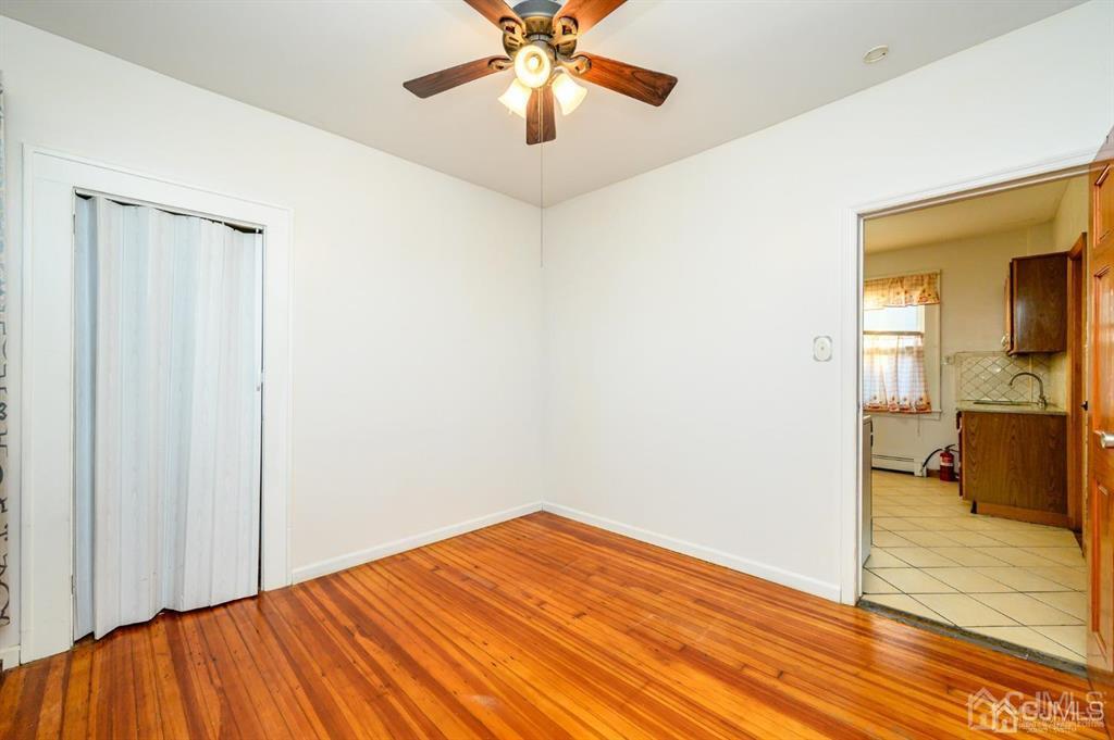 47 Marion Street Port Reading, NJ 07064 - Photo 21 of 57 a view of empty room with wooden floor