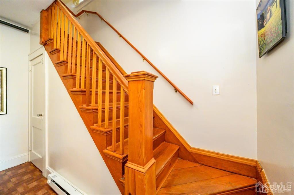47 Marion Street Port Reading, NJ 07064 - Photo 23 of 57 a view of staircase with railing and wooden floor