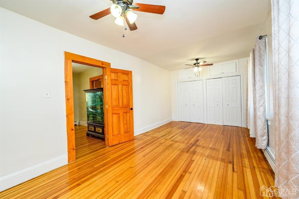 47 Marion Street Port Reading, NJ 07064 - Photo 33 of 57 a view of empty room with wooden floor